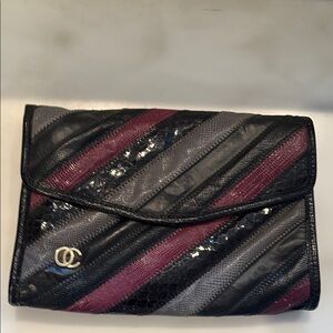 OC by Oleg Cassini Black and Purple Clutch with Textured Design